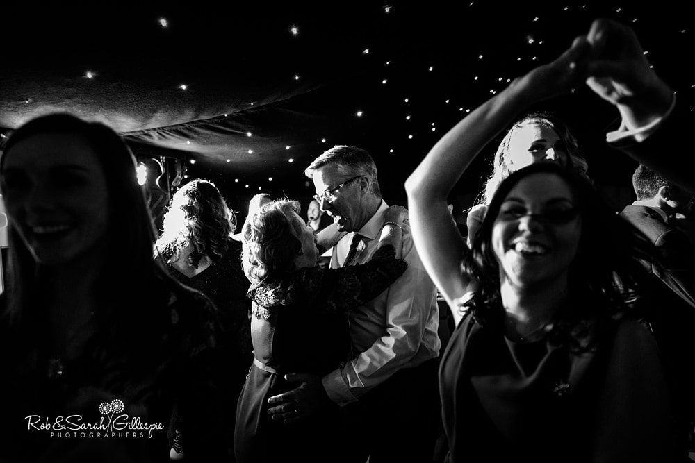 Bride, groom and guests dancing at wedding reception at The Boathouse Sutton Coldfield