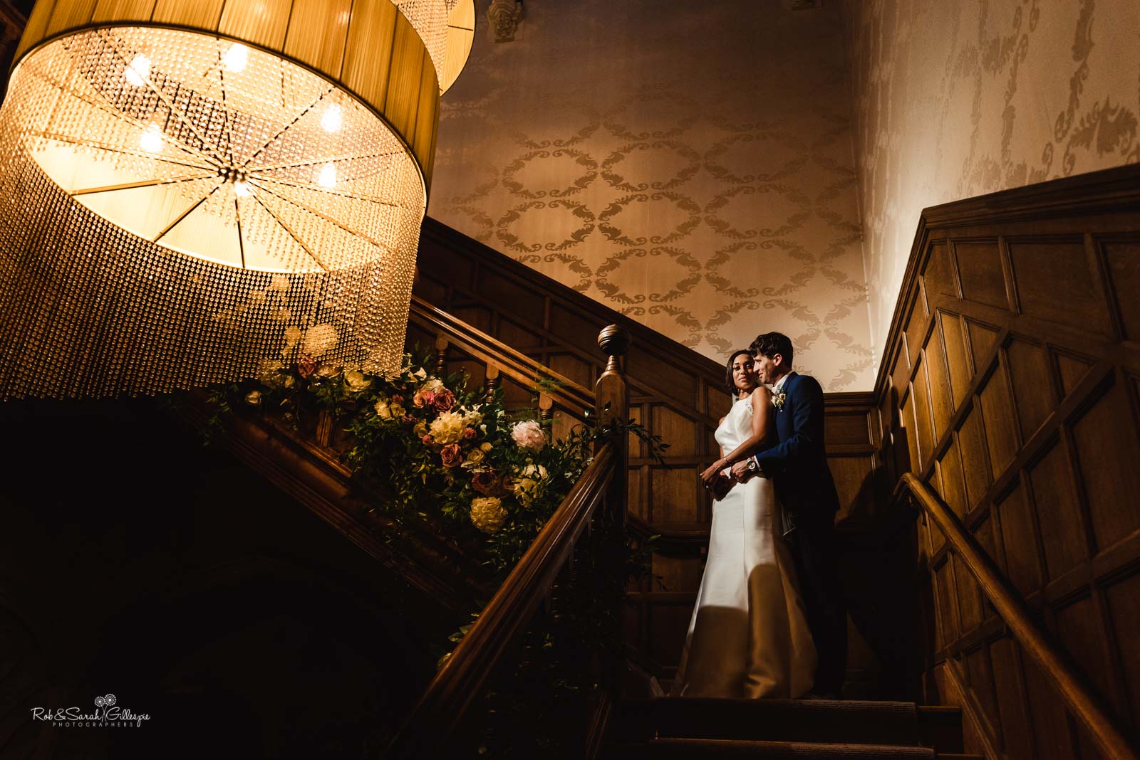 Hampton Manor staircase with bride and groom