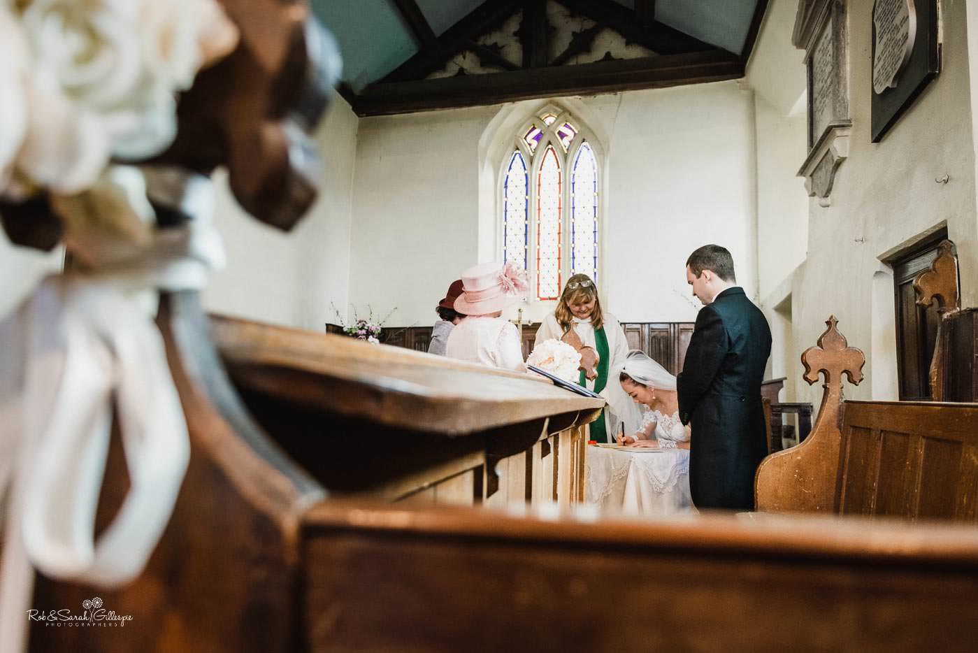 Wedding ceremony at St Peter's church Bourton-on-Dunsmore photographed by Rob & Sarah Gillespie