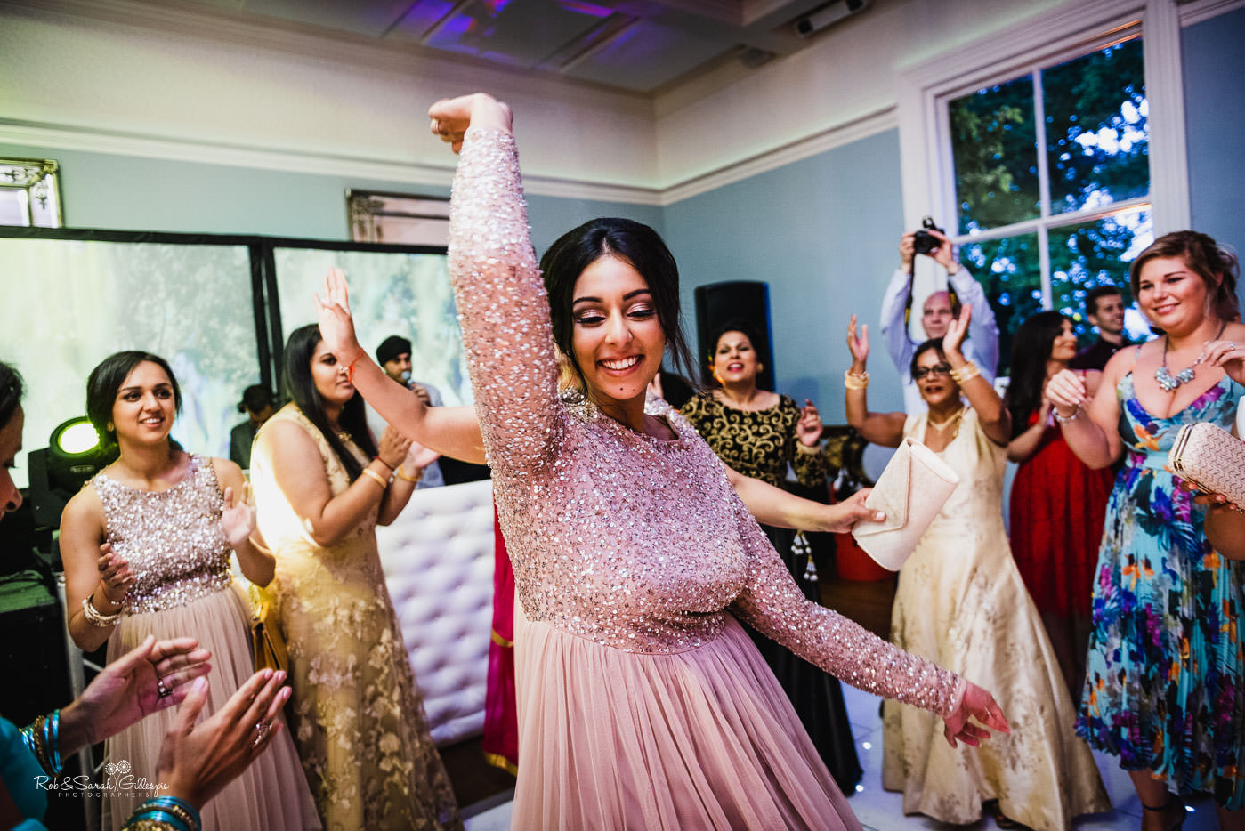 Bride and guests dancing at Pendrell Hall fusion wedding
