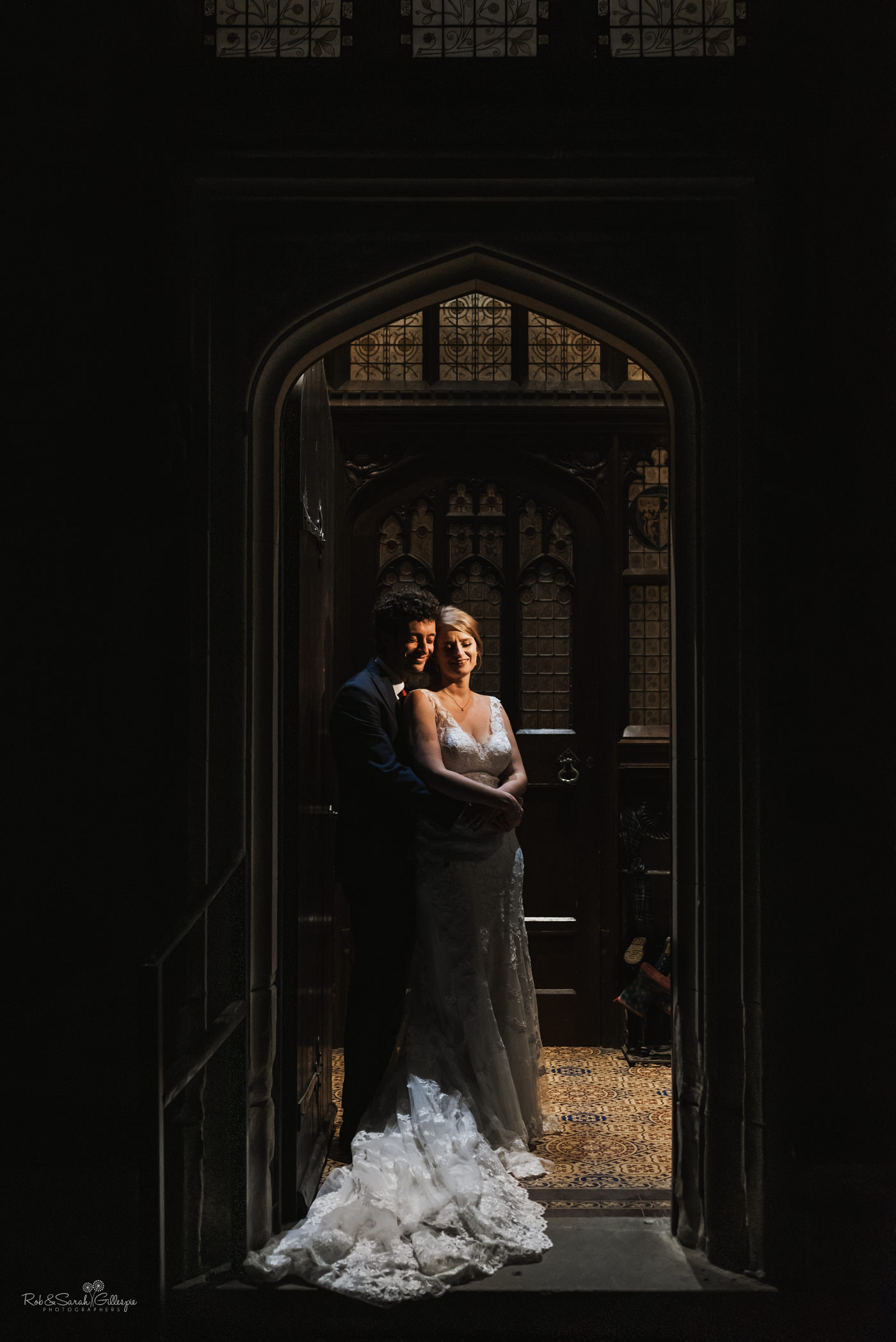 Bride and groom in doorway at Hampton Manor