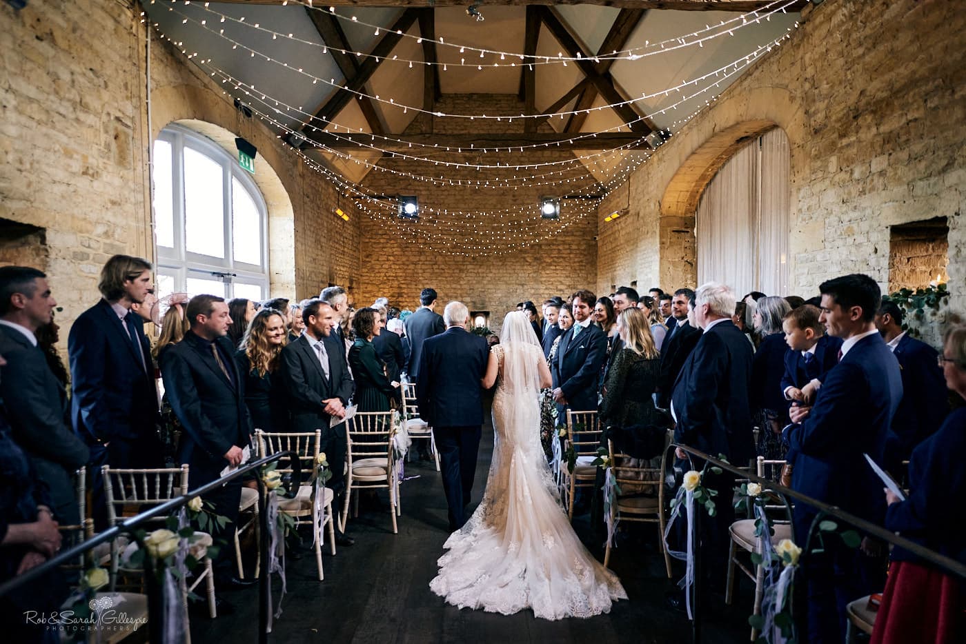 Bride and father walk up aisle at Lapstone Barn wedding ceremony