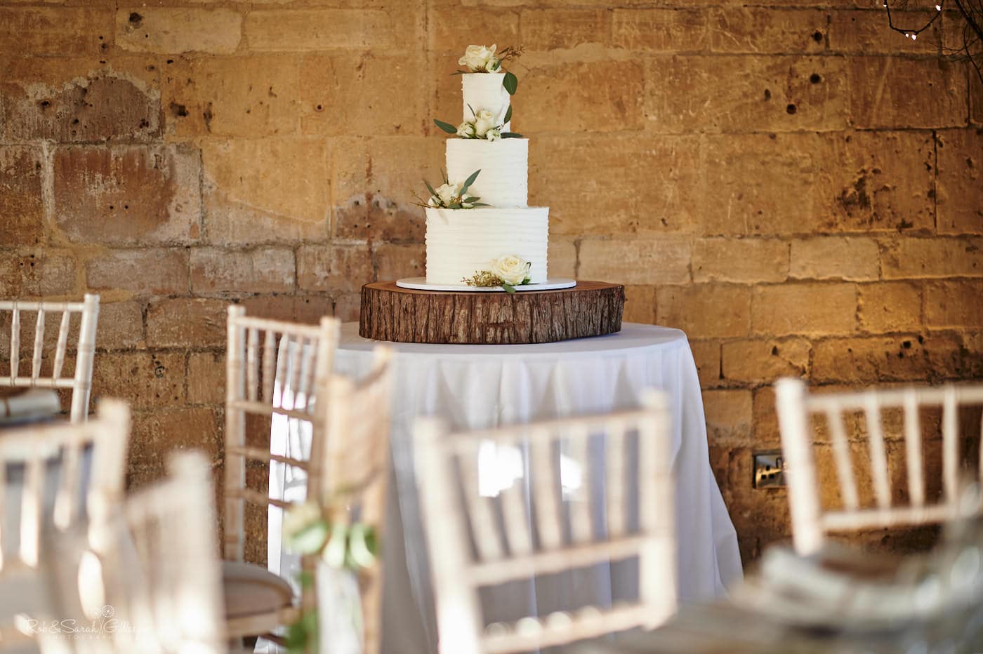 Beautiful wedding cake on wooden plinth