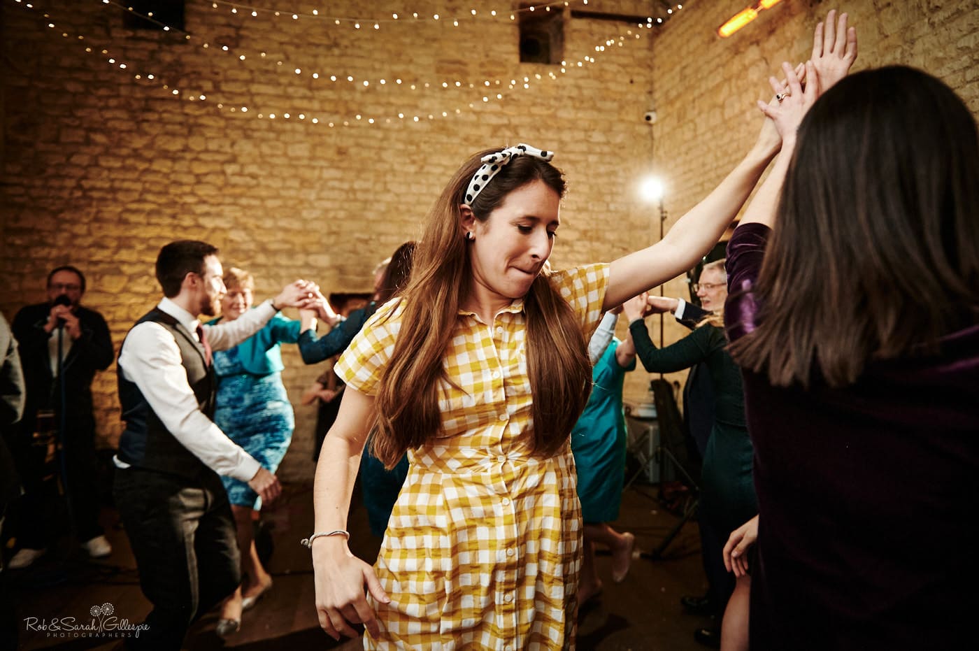 Wedding guests dance to ceilidh