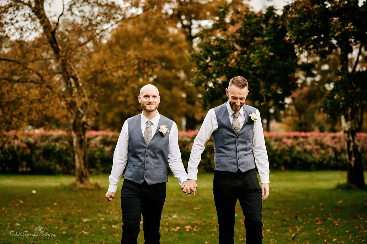 Two grooms walking in gardens at Moor Hall Hotel