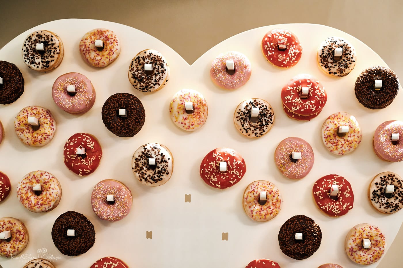 Detail of donuts on board at wedding party