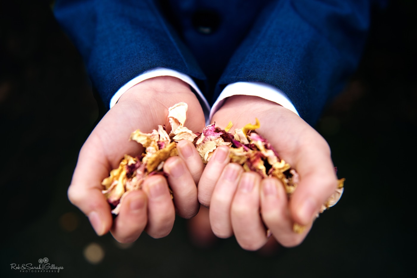 Hands holding wedding confetti