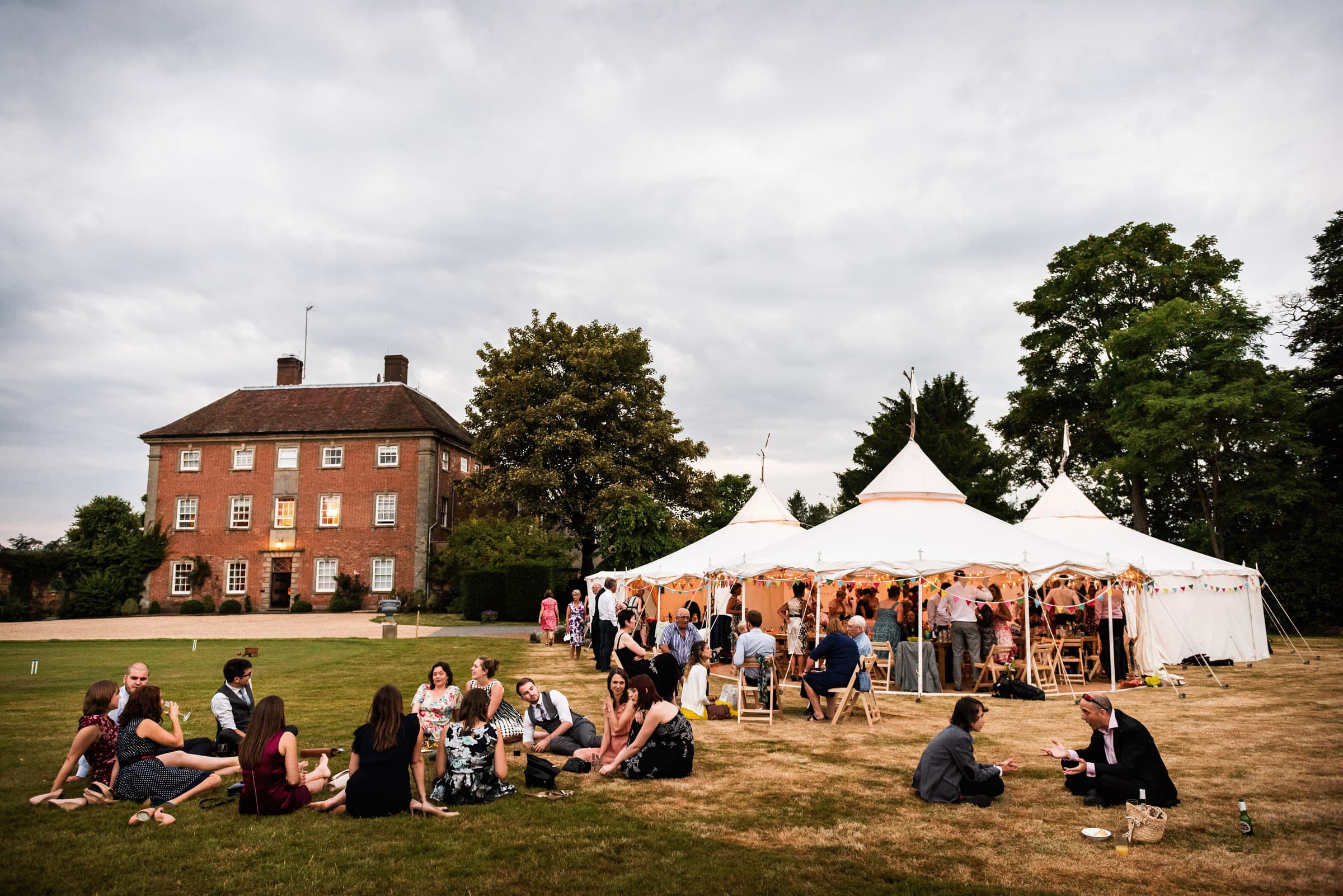 Wedding party relaxing at Sherbourne Park in Warwickshire
