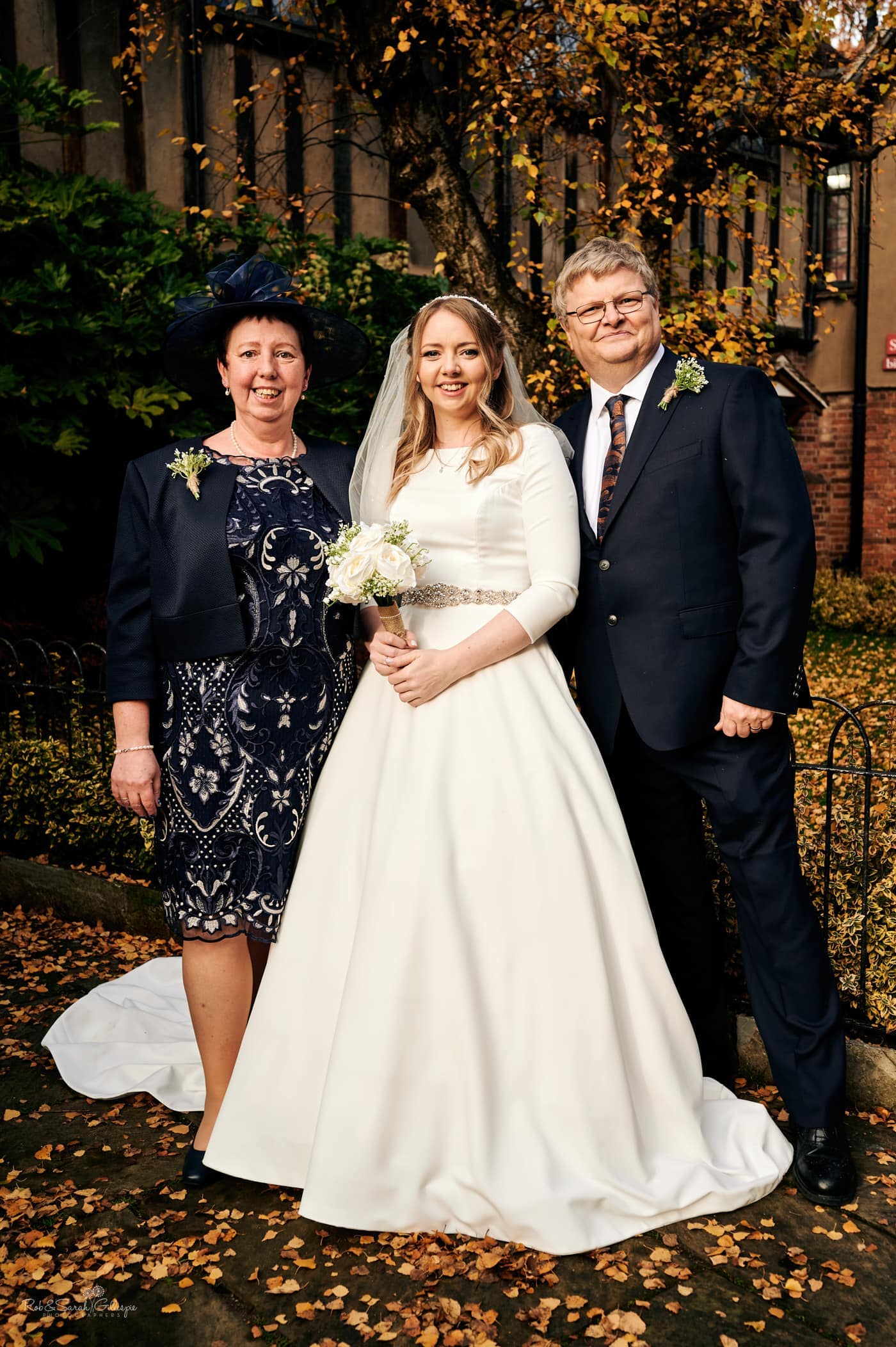 Small wedding group photo of bride and parents