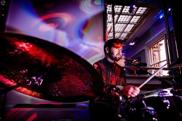 Drummer plays with band at wedding reception