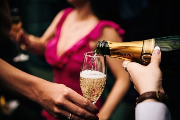 Champagne poured into glass at wedding reception