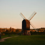 Bride and groom with old windmill