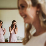 Bridesmaids react to seeing bride in wedding dress