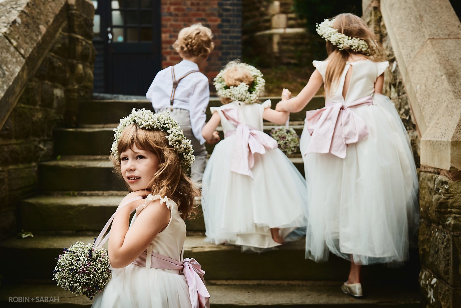 Flowergirl turns as she arrives at wedding ceremony