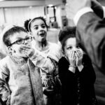 Kids react to magician at wedding reception