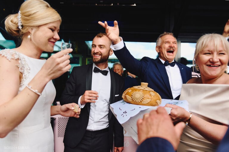Bride and groom enjoy Polish bread and salt ceremony