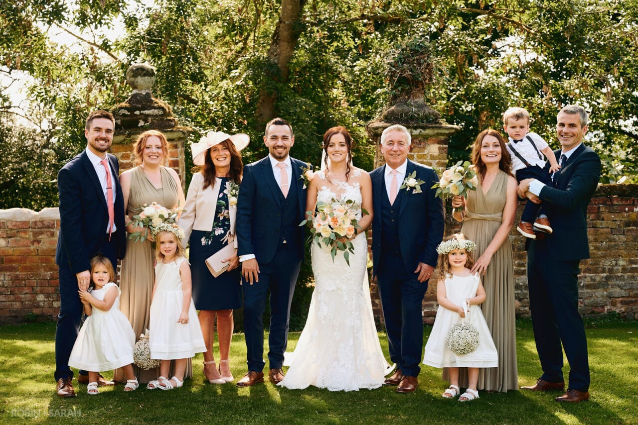 Wedding group photo in gardens at Gorcott Hall