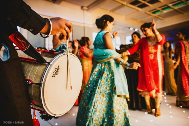 Indian dhol drums as guests dance at Pendrell Hall wedding