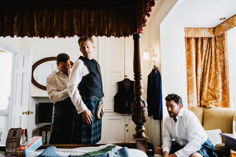 Groom and groomsmen get ready for wedding