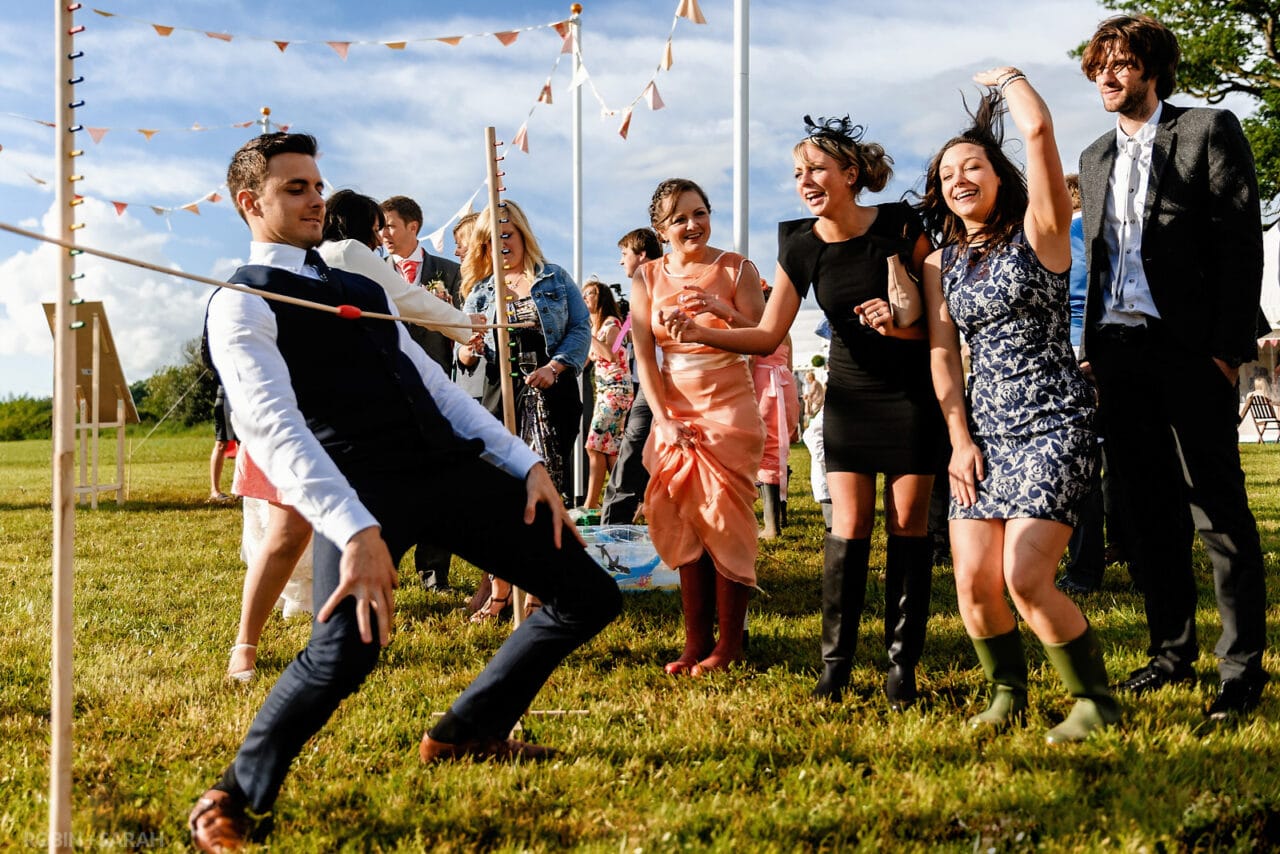 Wedding guests relax and limbo dance