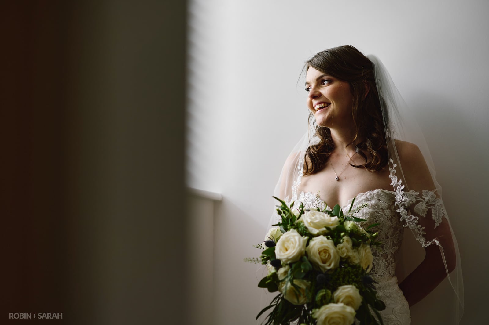 Portrait of young bride in window light