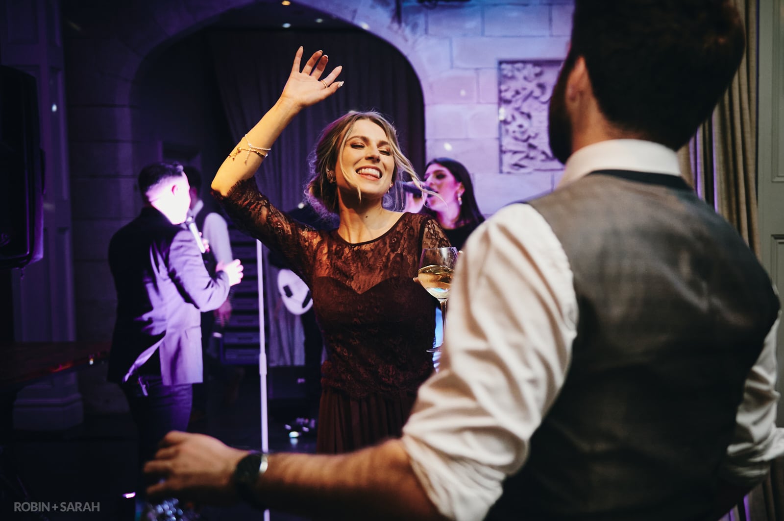 Wedding guests dancing as live band plays