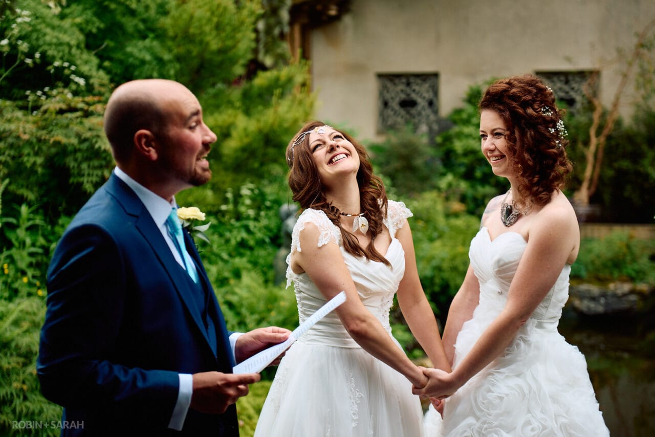 Two brides happy and joyful during wedding ceremony