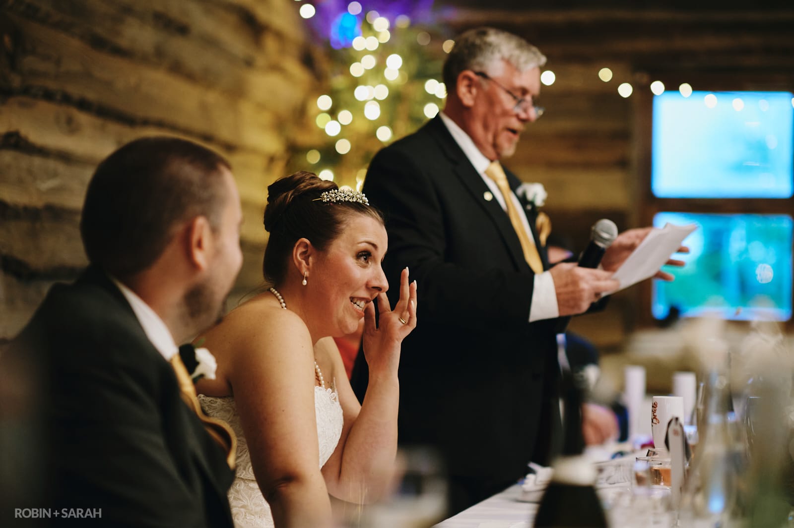 Wedding speeches in wooden barn