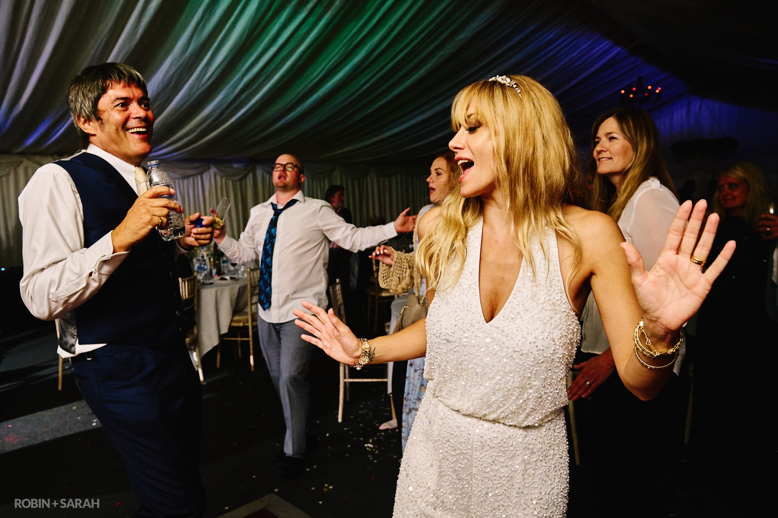 Bride and groom dancing in marquee at Forest's Edge wedding venue in Far Forest