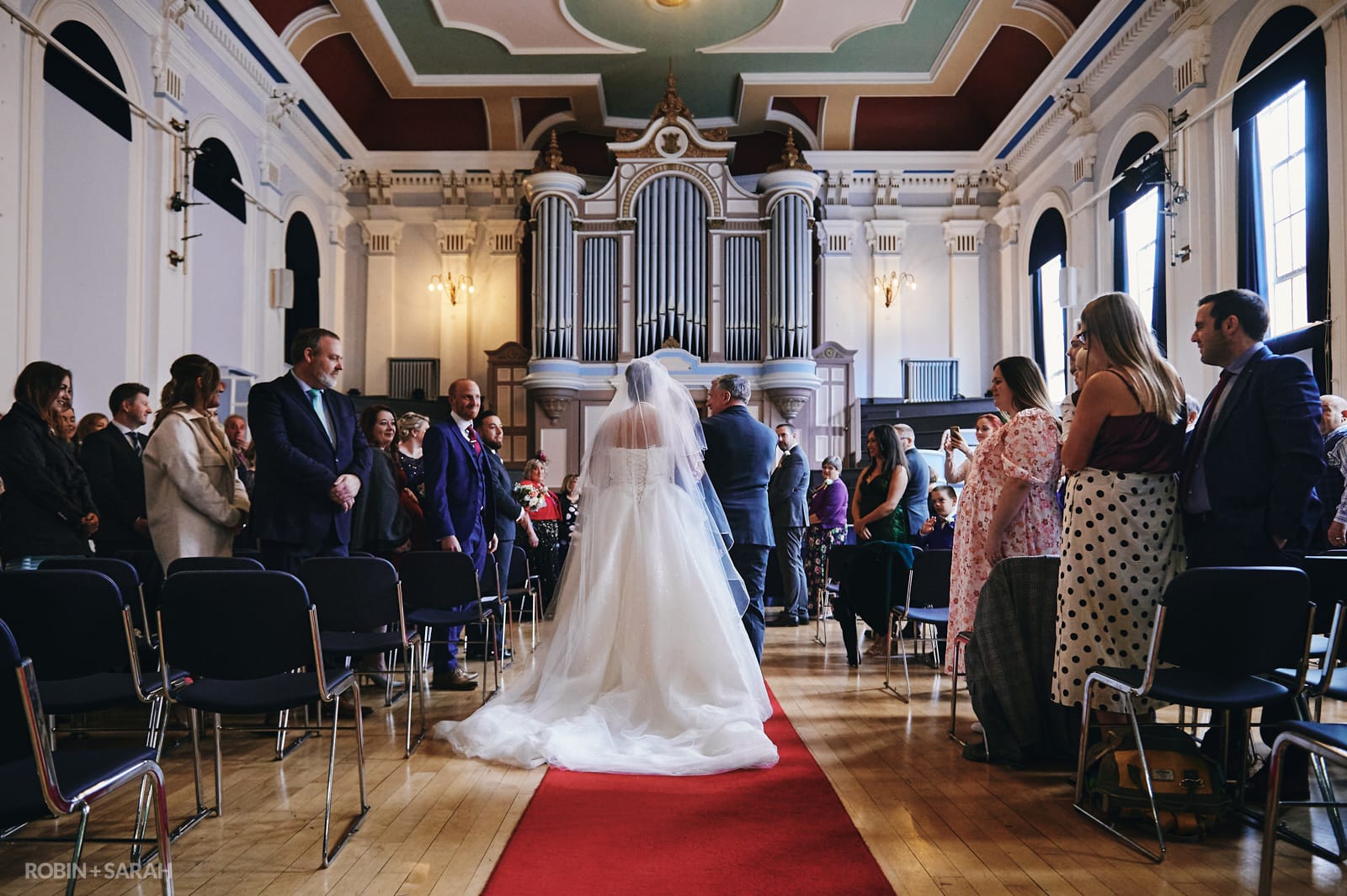 Bride and father walk up aisle for wedding ceremony at Kidderminster Town Hall