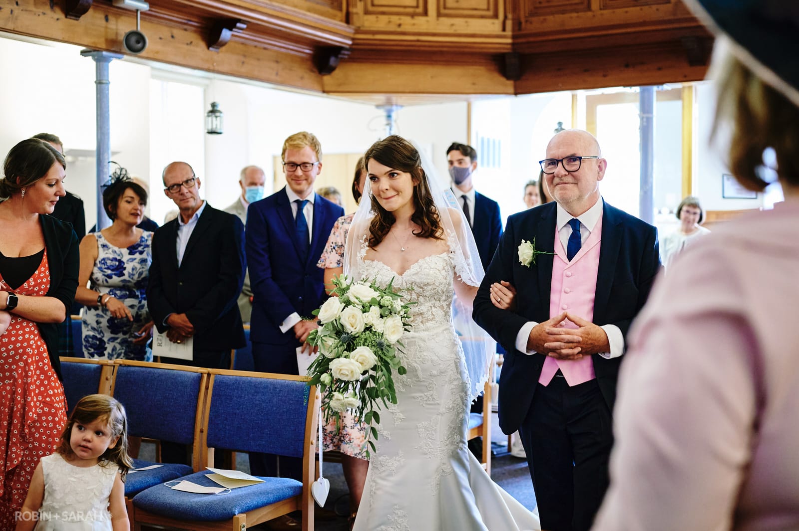 Bride and father walk up aisle at Long Buckby Baptist Church wedding