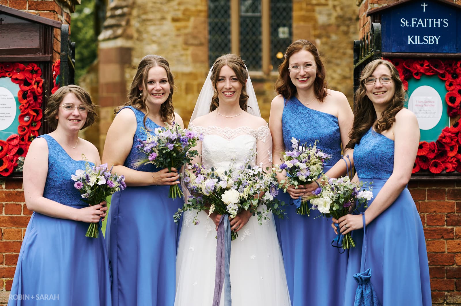 Group photo of bride and bridesmaids at St Faiths church Kilsby