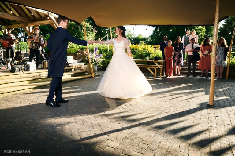 Bride and groom first dance outside at Wethele Manor