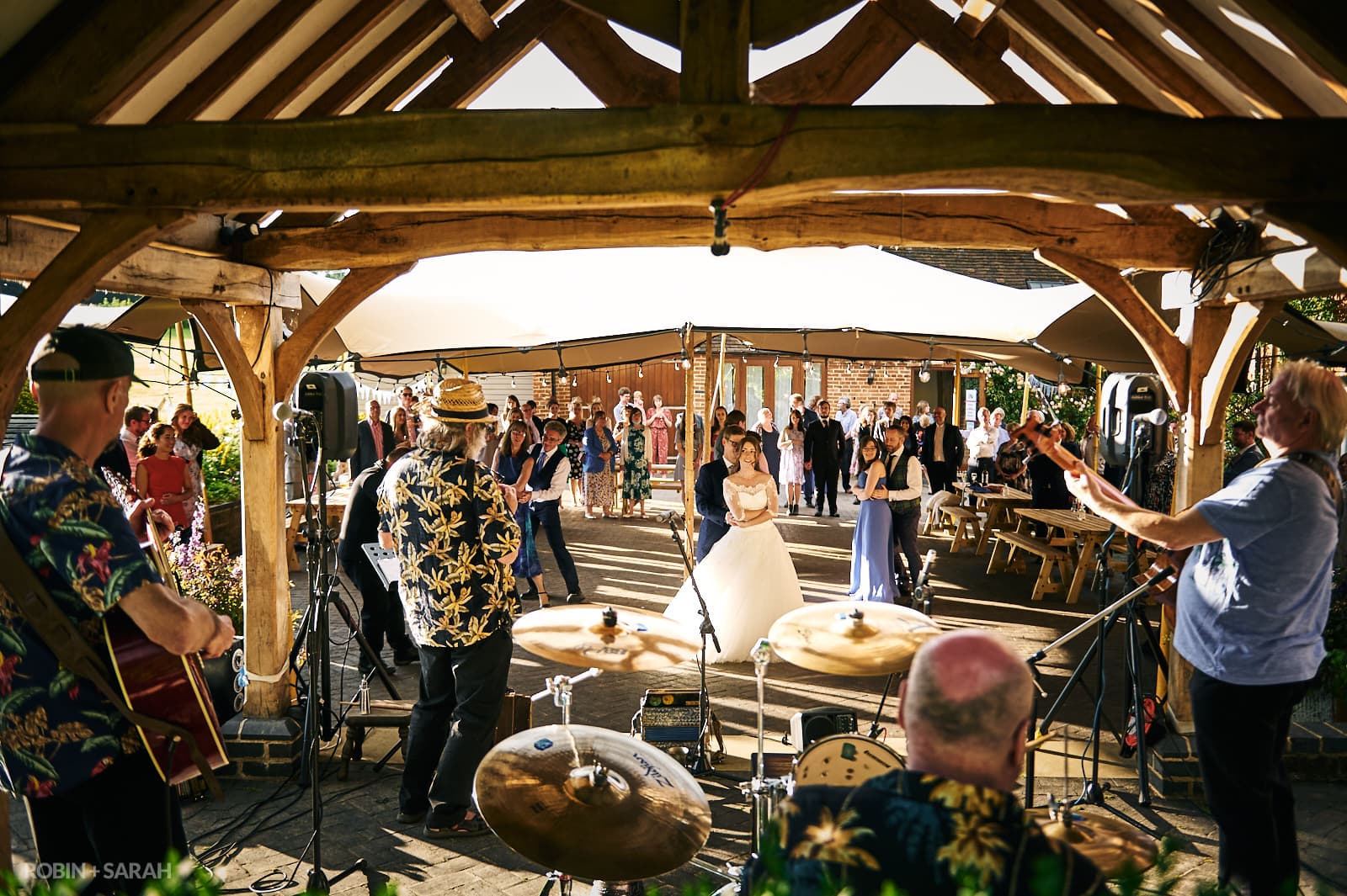 Ceilidh band play while wedding guests dance outside at Wethele Manor