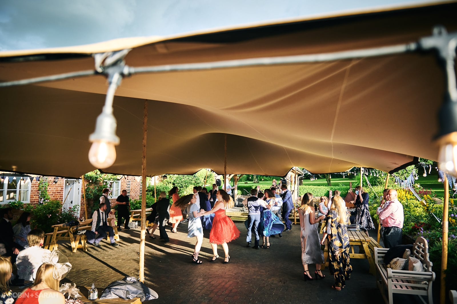 Wedding guests dance outside at Wethele Manor