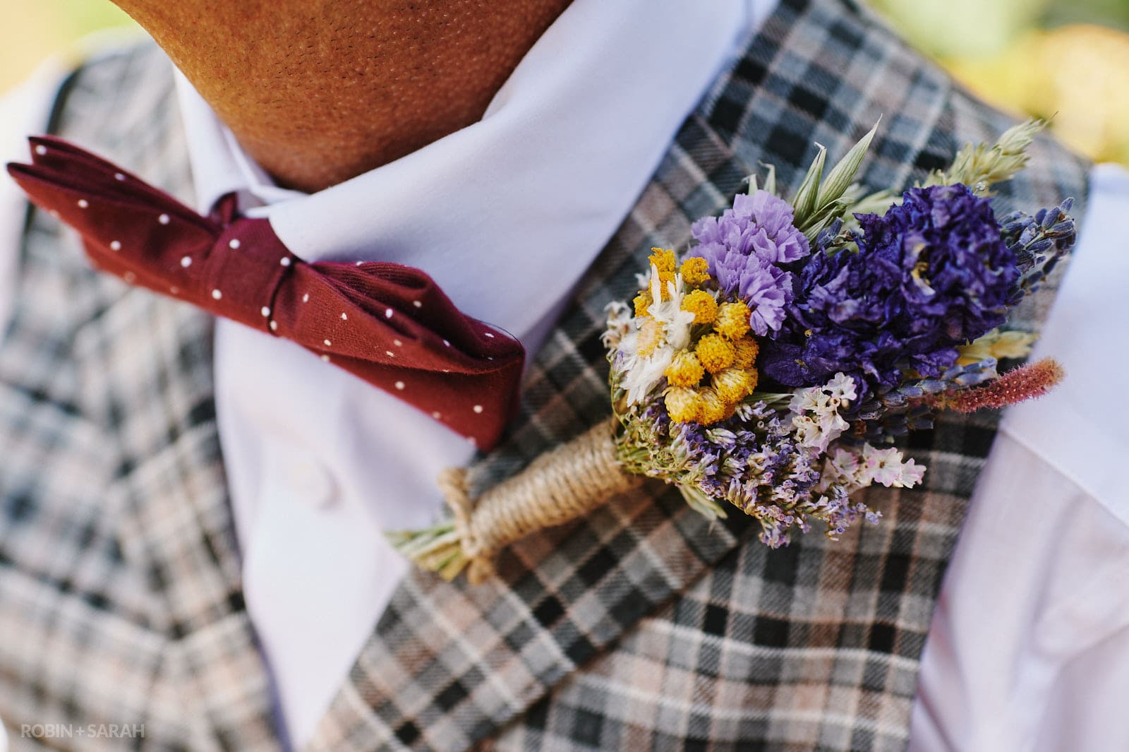Close up of groom's buttonhole flowers