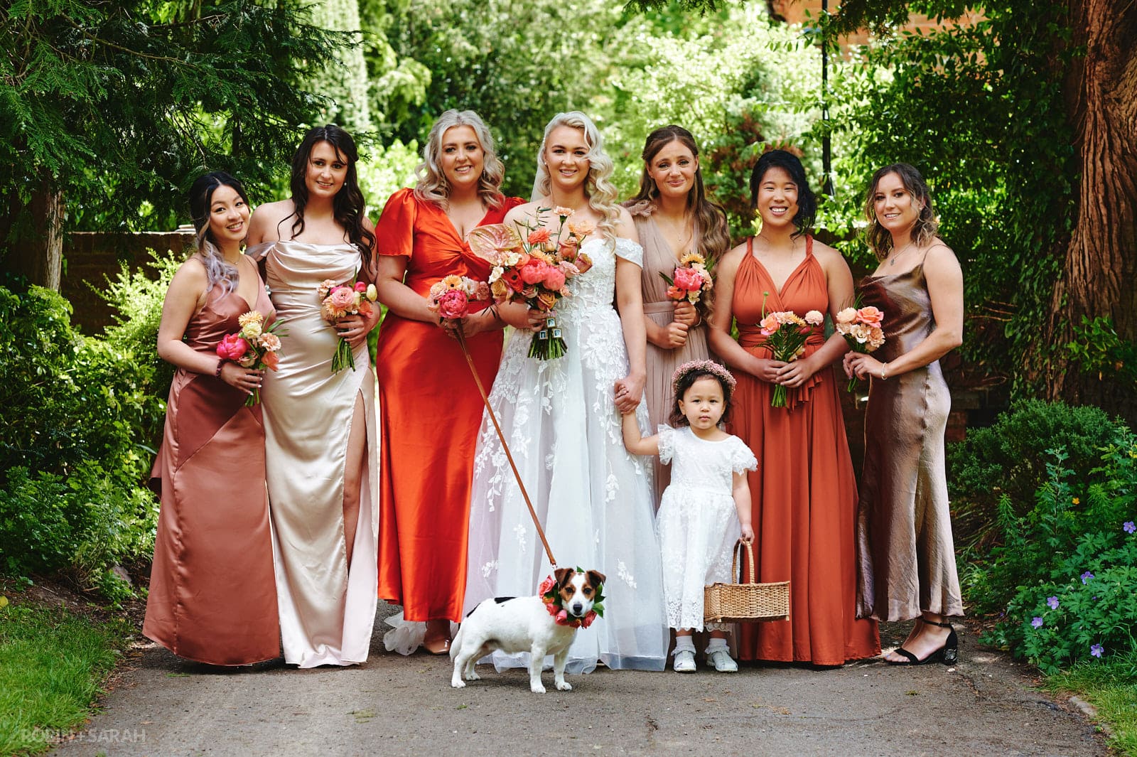 Bride and bridesmaids pose for photo.