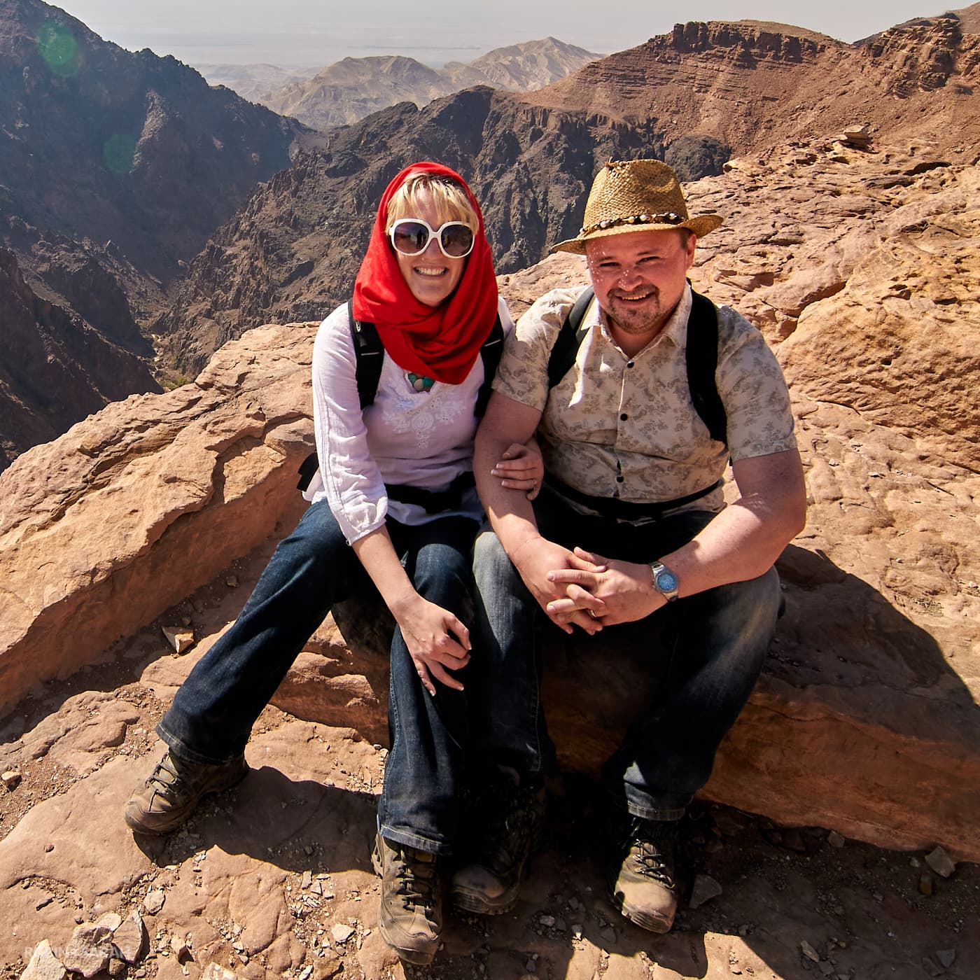 Robin & Sarah sitting on top of a mountain