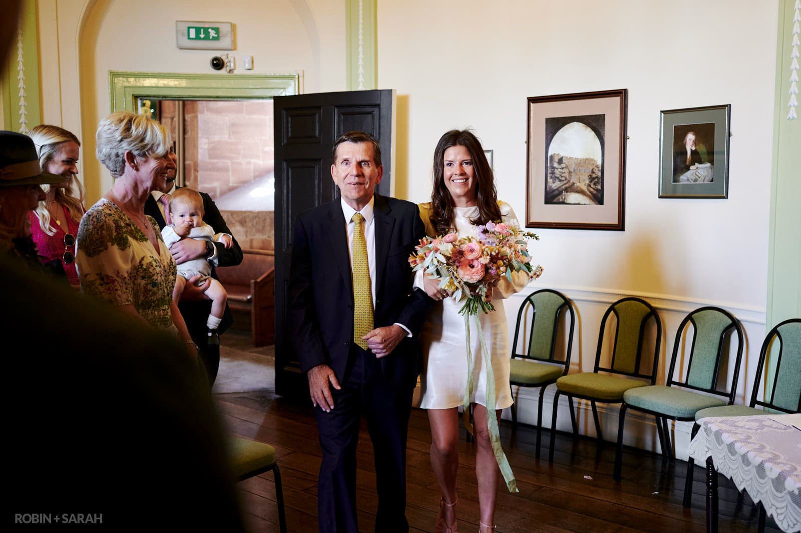 Bride and father enter The Circular Room for wedding ceremony at Shrewsbury Castle