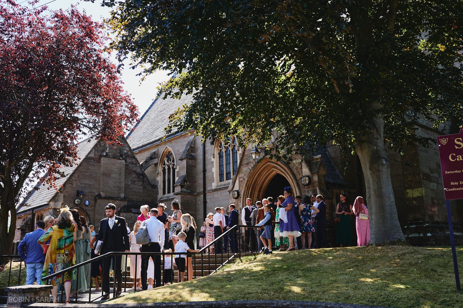 Wedding guests gather at St Peter's church in Bromsgrove