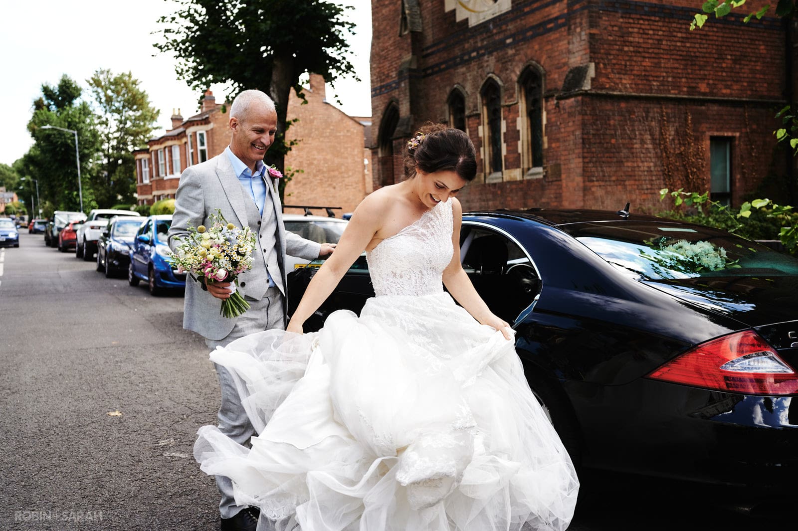 Bride gets out of car at St Pauls church Leamington Spa