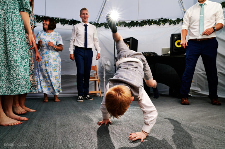 Young boy break dancing at wedding