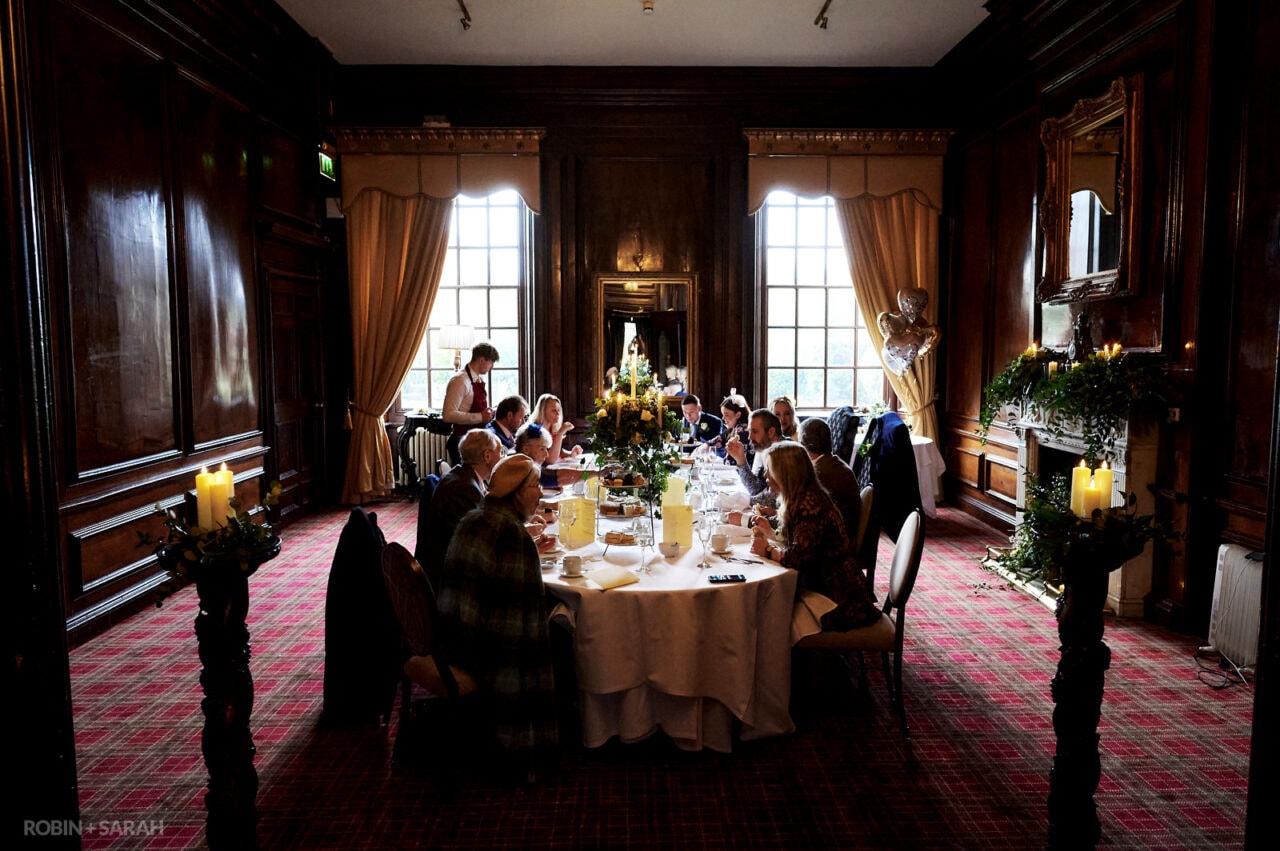 Small wedding part sit down for afternoon tea in Walnut Room at Coombe Abbey