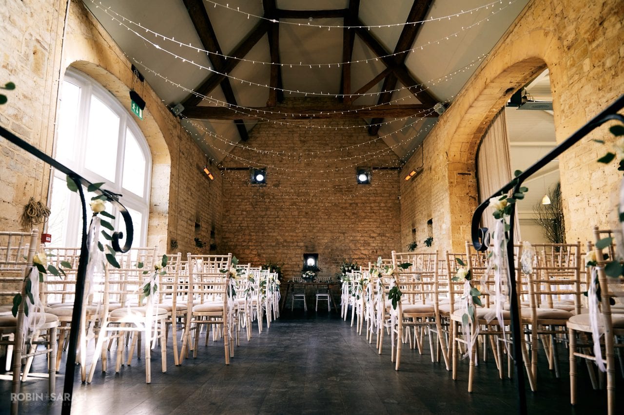 Interior of Northwick Barn set up ready for a wedding ceremony.
