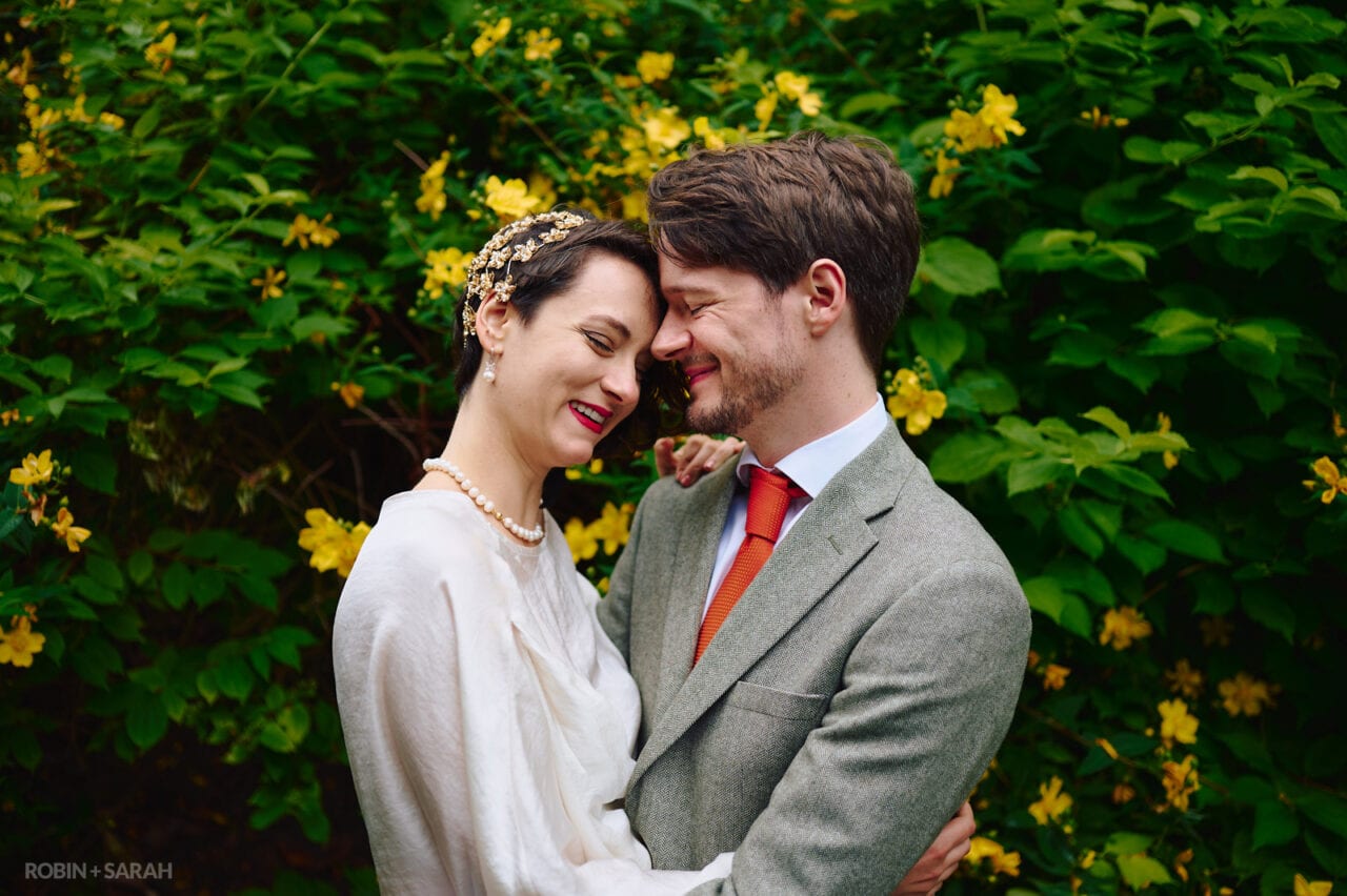 Bride and groom relaxed and happy in Priory Park Malvern