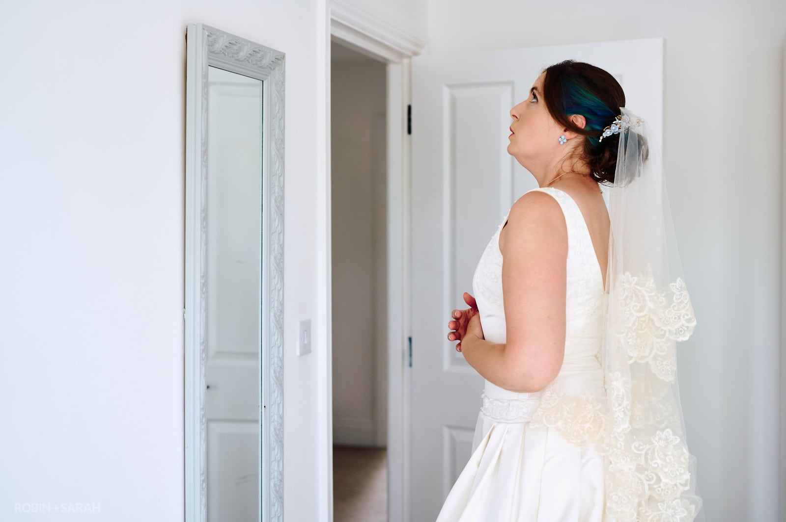 Bride takes a moment as she prepares for wedding day