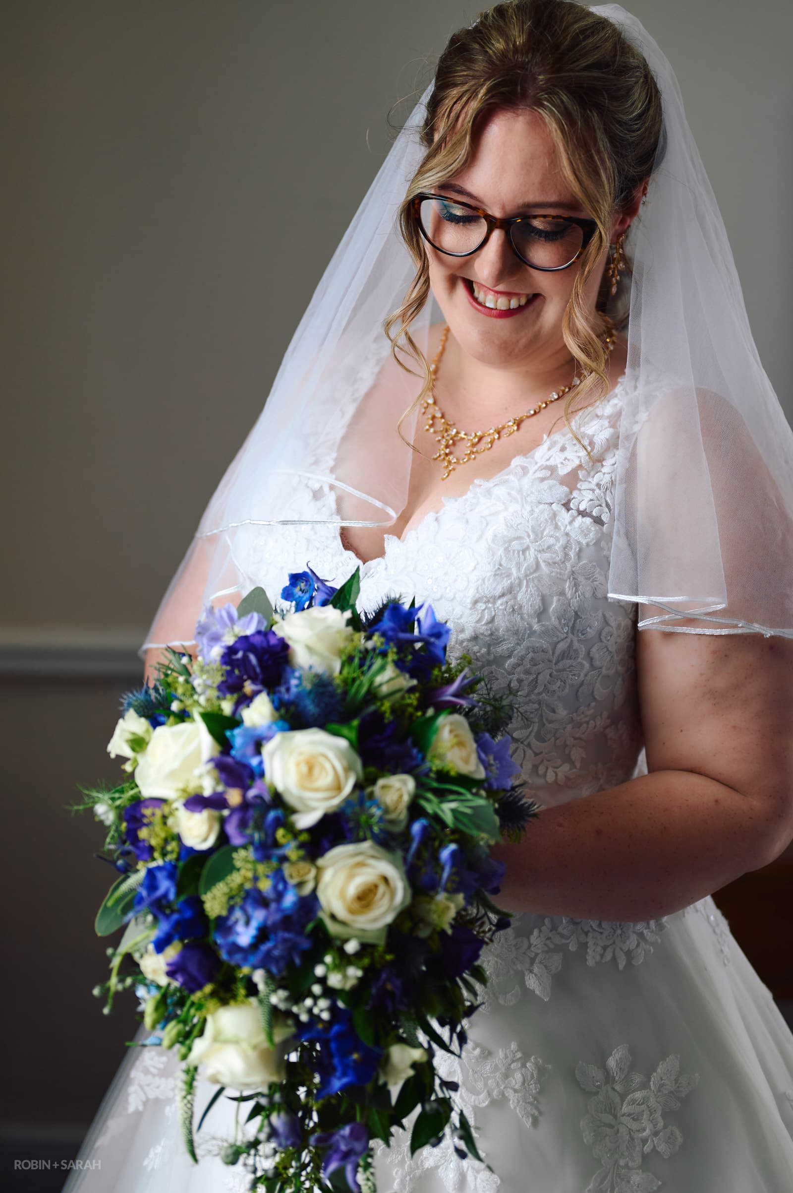 Portrait of bride with beautiful bouquet of flowers