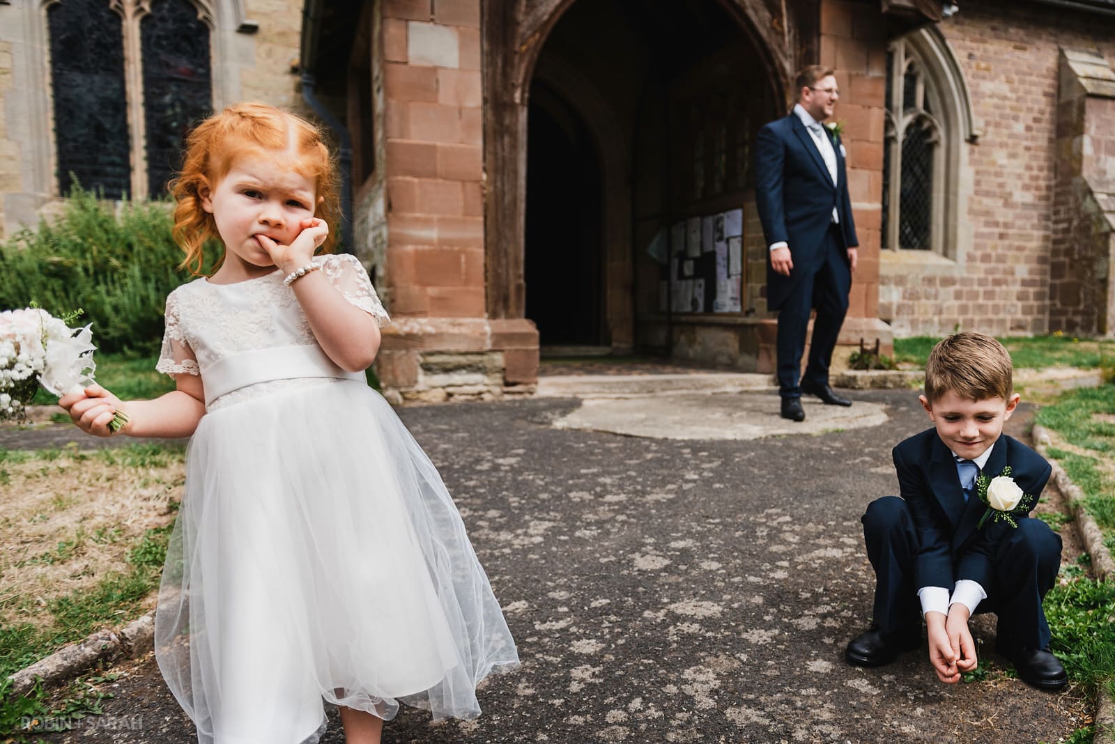 Young kids arrive at church for wedding