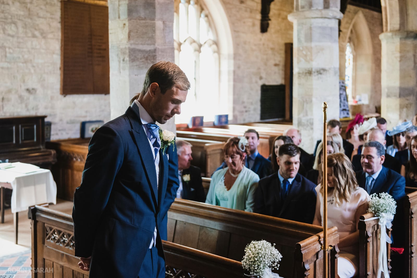Groom waits in church for bride's arrival