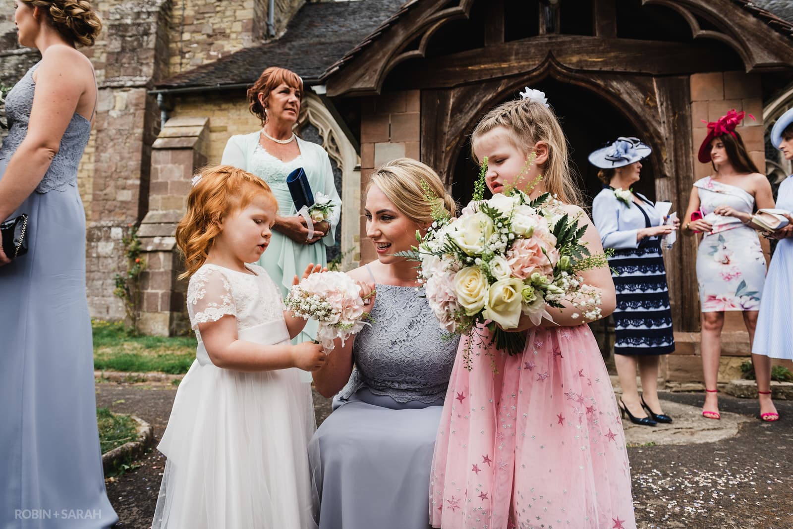 Bridesmaid and flowergirls outside church
